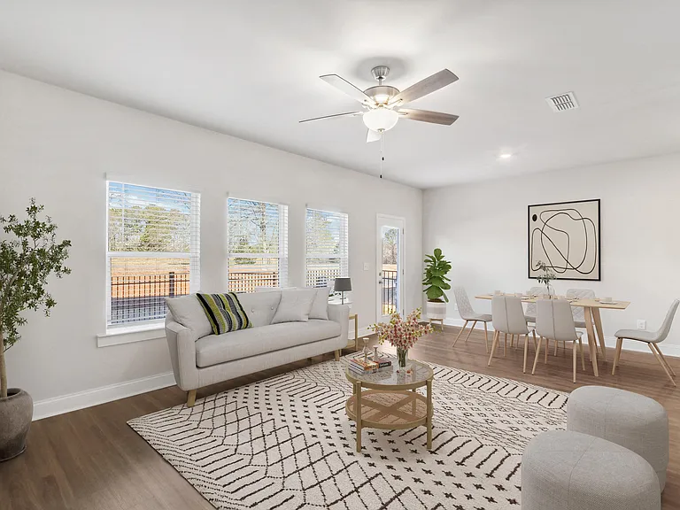 A view of the living room and intimate dining space