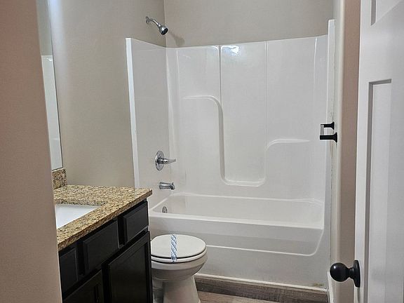 Tub and shower - washer and dryer in this room
