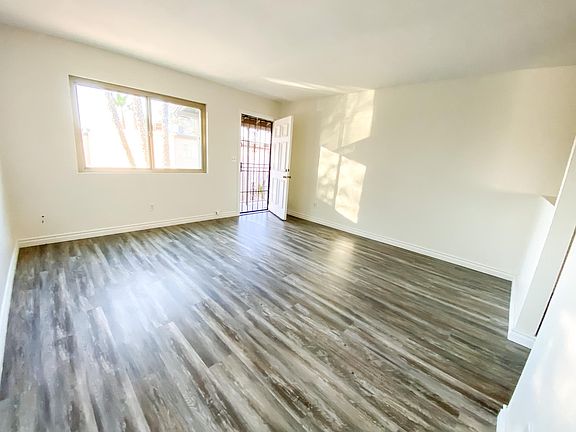 Open concept living: Large living room is connected to dining and you can see into kitchen.