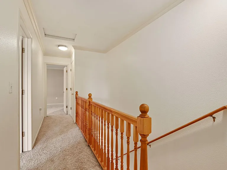 Staircase and hallway to second level.