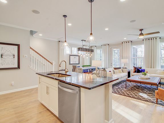 The Kitchen opens to the main gathering and dining areas, perfect for entertaining - Model Represen