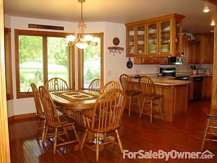 Open Concept : The dining room & kitchen (as shown) is open to vaulted living room and foyer