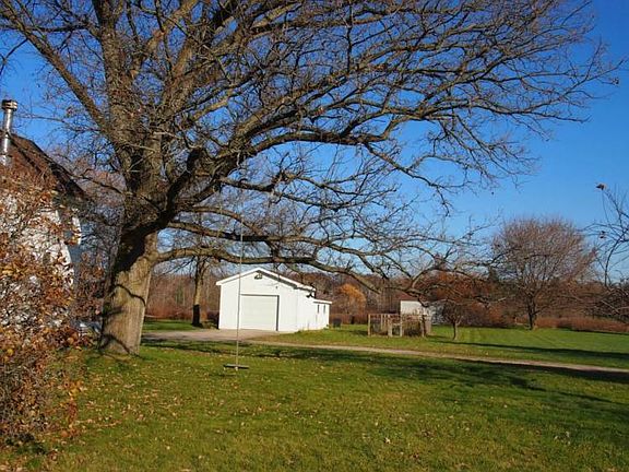 Can you see someone swinging from this great tree?  Detached oversized 1.5 car garage plus a real barn.
