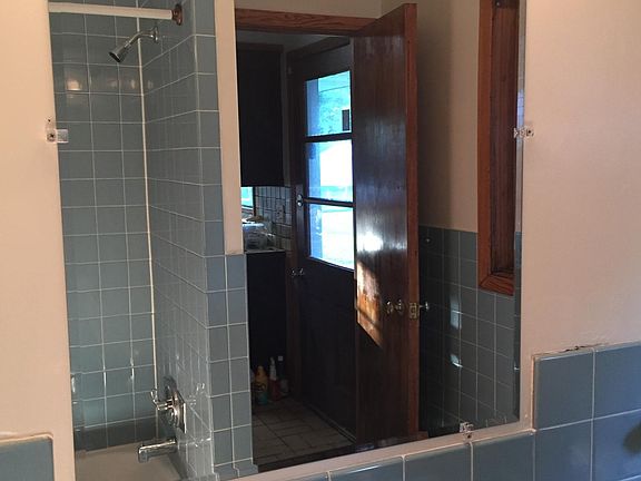 Updated mirror and faucet. Original sink.