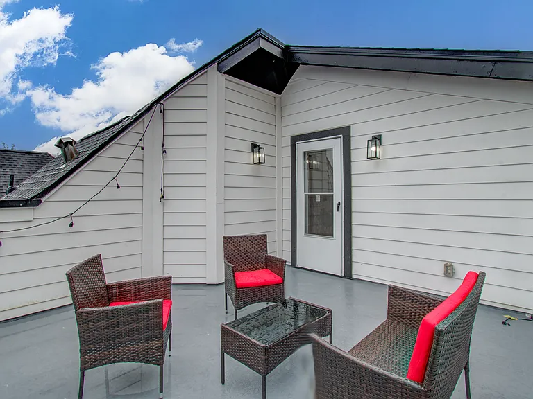 Private rooftop deck with comfortable outdoor space to relax, enjoy fresh air, and unwind