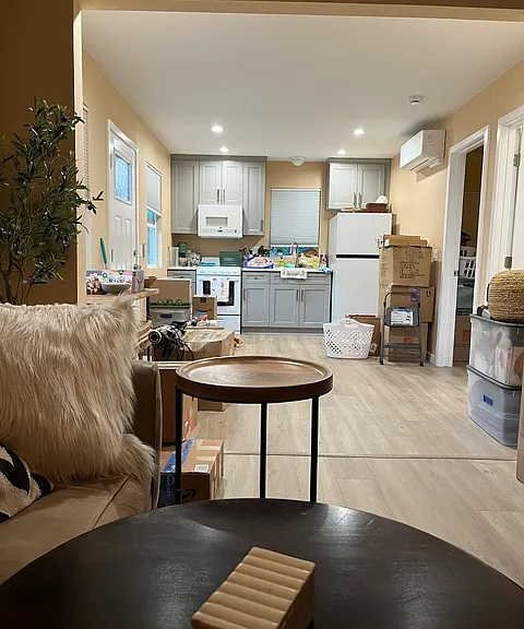 View from living room into kitchen and dining area.