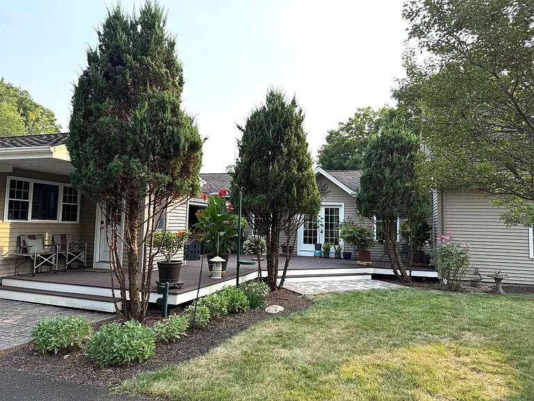 Landscaped backyard and rear view of the home