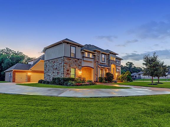 This fabulous 2 story home with a Porte-Cachere and 4 garages is located on a completely gated 1.23 acres lot.
