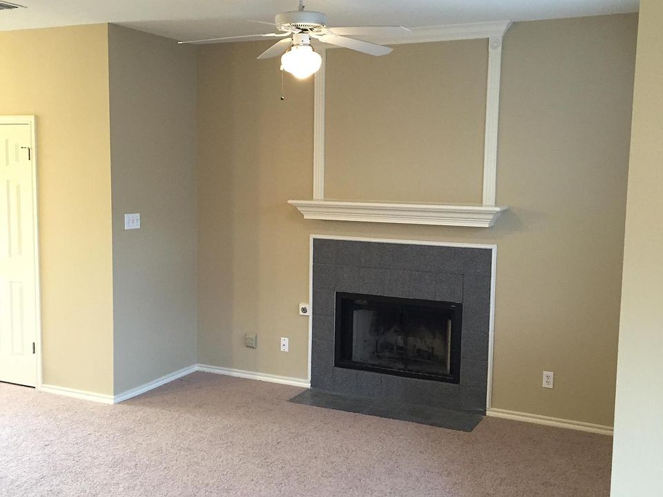 Living room open to kitchen and overlooking backyard
