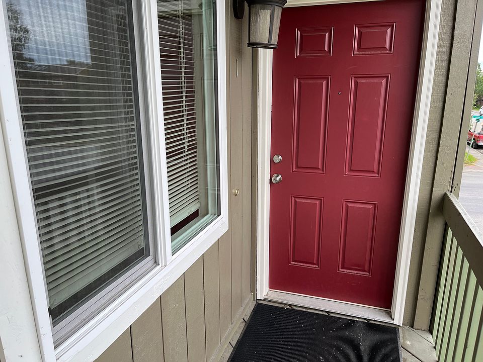 Door to the unit, large window on the left is the dining room