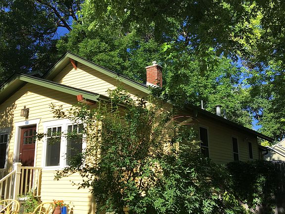 Corner lot with sun and trees.