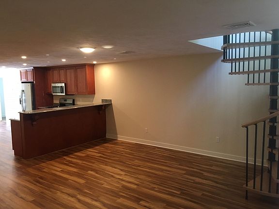 Gleaming floors and spiral staircase to second floor