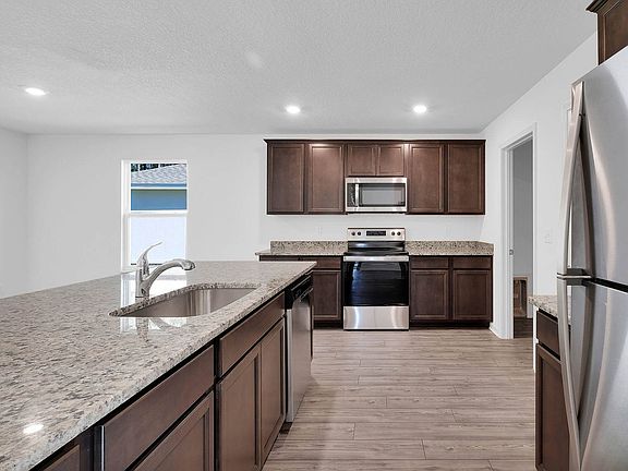 Gorgeous granite countertops abound in the Four Winds plan