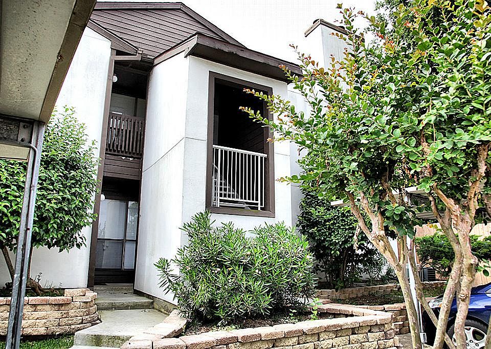 Front of building. Unit is on second floor and has a designated carport right in front.