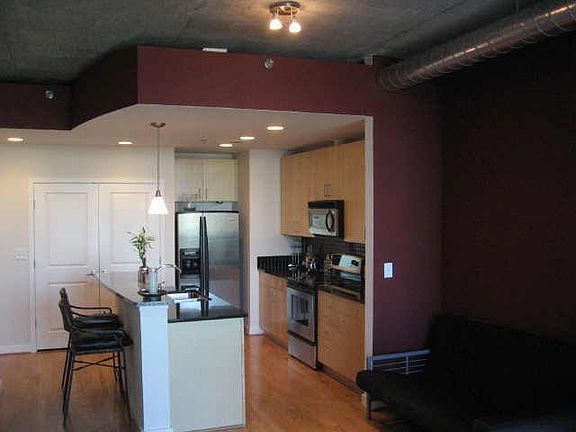 Hdwd floors in main living area, exposed duct work 