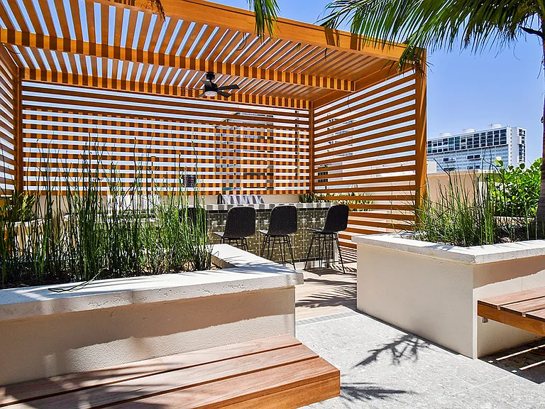 Griffis West Palm apartments rooftop deck with gazebo and built in BBQ grills.