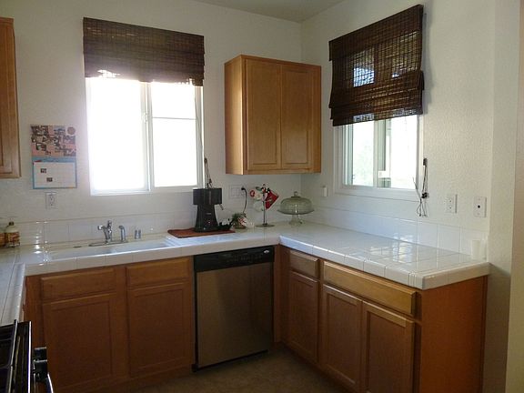 Kitchen has Maple Cabinets