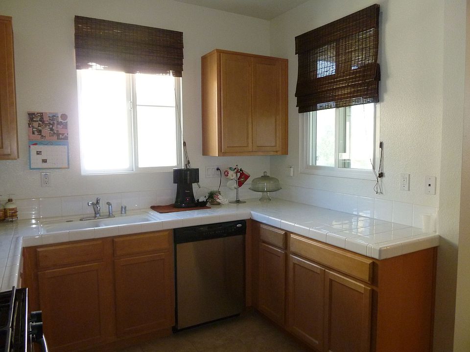Kitchen has Maple Cabinets