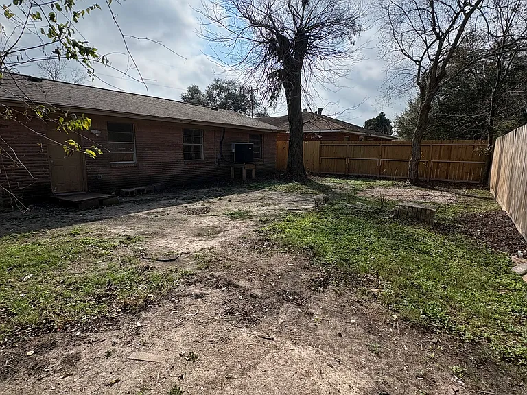 Fully fenced in large back yard. No neighbors on the back side of the house.