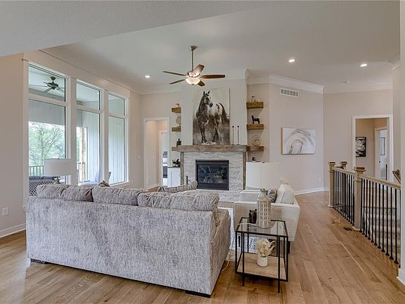 Great Room - Windows look out to green space and trees.