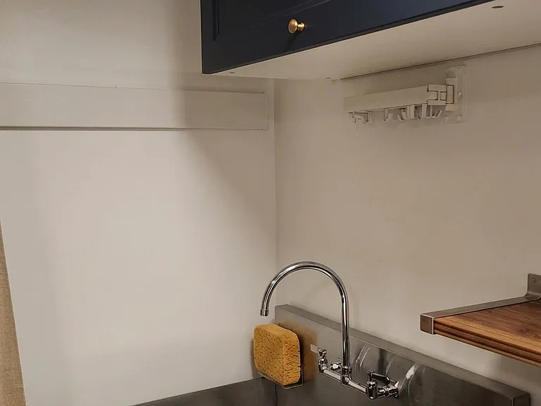 Industrial utility sink in laundry room closet.