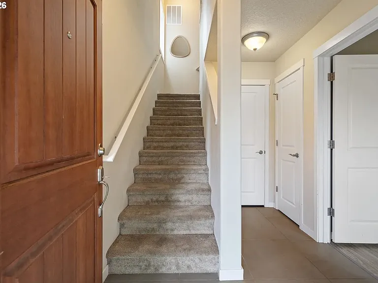 Separate bedroom on entry level can be utilized for a subtenant, teenager or young adult child, or multi-generational suite