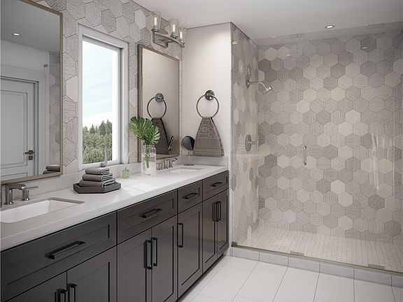 Luxurious master bath: quartz countertops, elegant designer tiled bath area with oversized walk-in shower.. Photo not of actual home and may included some personalized features. 