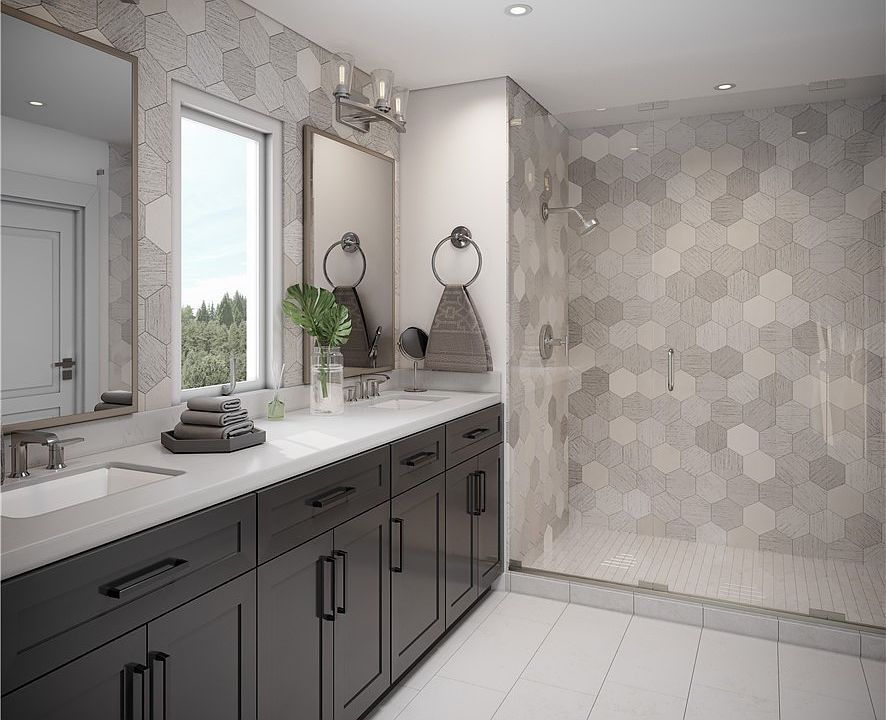 Luxurious master bath: quartz countertops, elegant designer tiled bath area with oversized walk-in shower.. Photo not of actual home and may included some personalized features. 