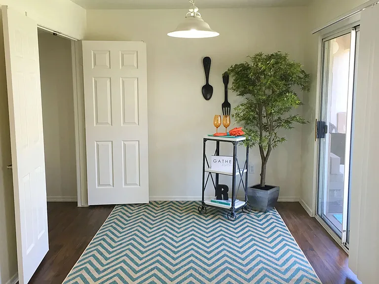 Savor meals in your separate dining area with patio sliding doors, providing a picturesque backdrop for family gatherings.