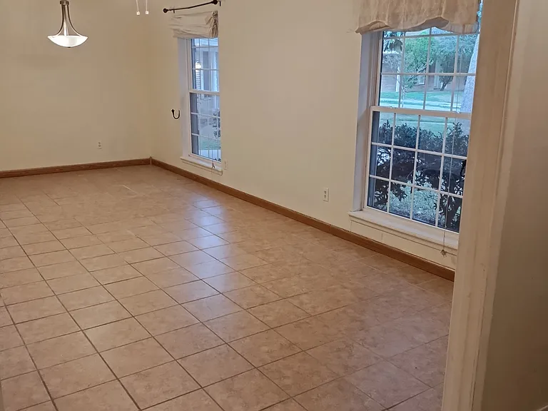 Living Room/Dining Room facing front of house from Entryway.