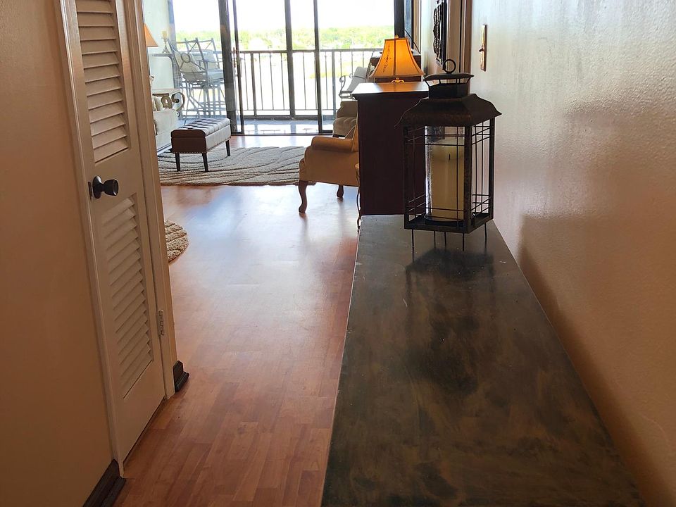 Entry to unit. Kitchen and living room to the left. 2 bedrooms and their baths to the right