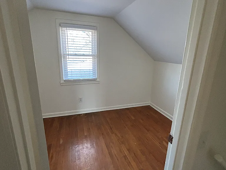 This is a small bedroom upstairs (picture makes it look larger than it really is). The closet for this room is in the hallway.