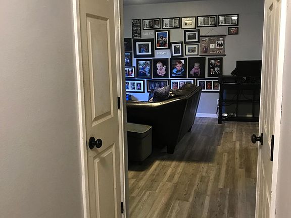 hallway leading to living room - new flooring