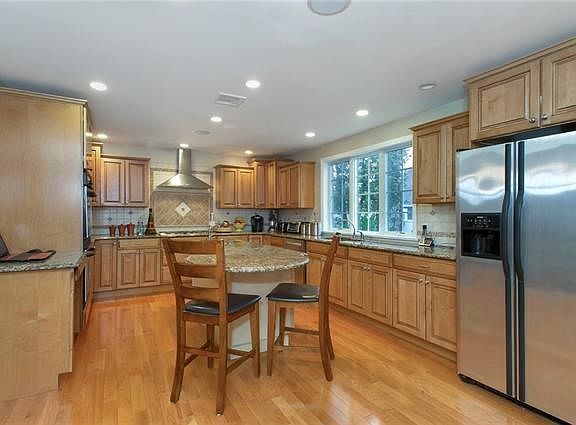 Another view of kitchen showing large center island