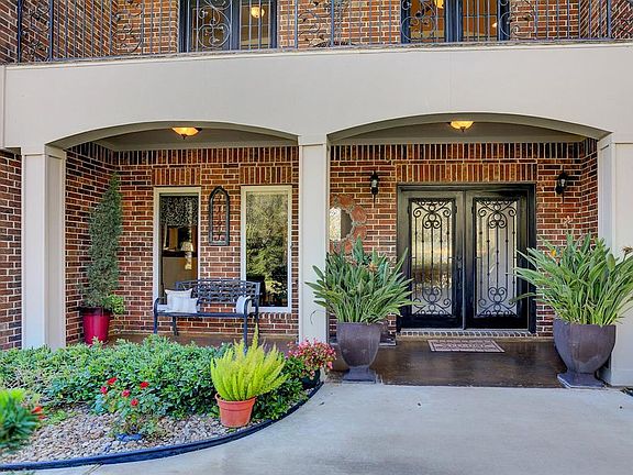 Enjoy sitting on the front porch and enjoying looking at the fountain and front pond.