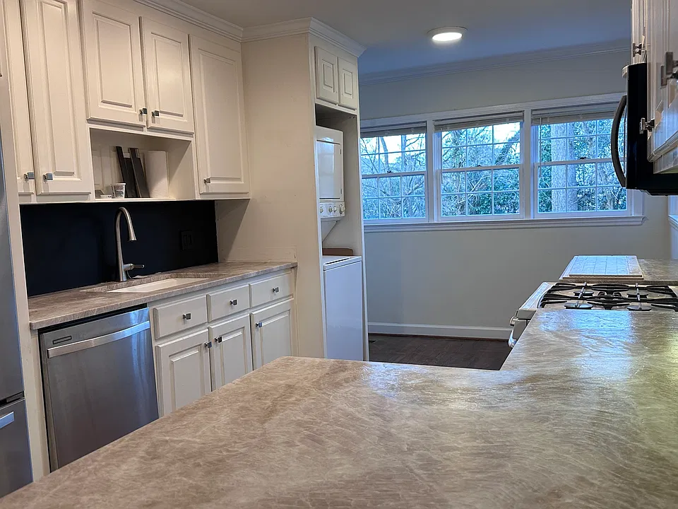 2025: KItchen updated with Taj Majal quartzite countertops and chalkboard backsplash.