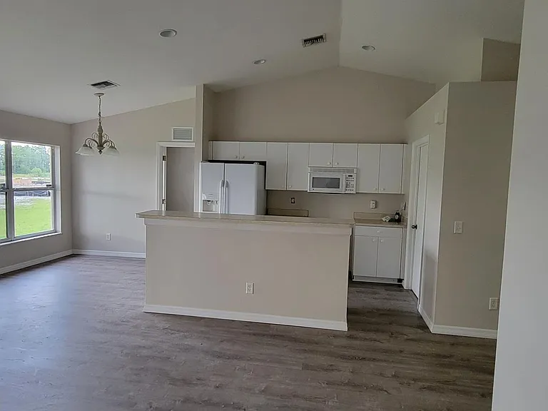 Kitchen and Doorway to MBR from Hall / Main Living Area