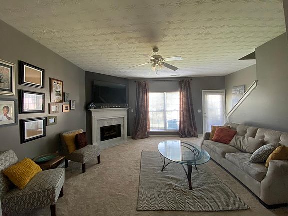Spacious living room area can accommodate a nice family night of watching television or a gather to enjoy a sports game or game night.