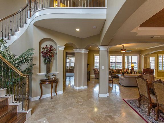 Travertine and wood floors throughout the first floor, open and flowing floor plan - perfect for ent