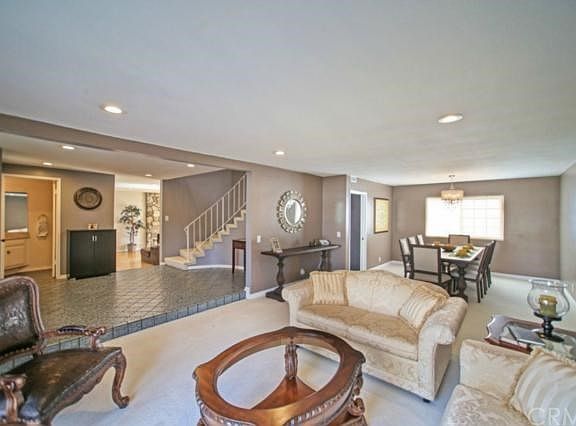 Formal living with smooth ceilings; newer recessed lights and designer paint