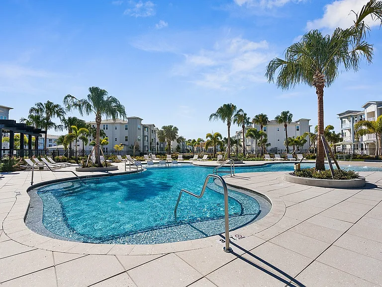 Experience tropical relaxation in this lavish pool area, perfect for leisure and enjoyment.