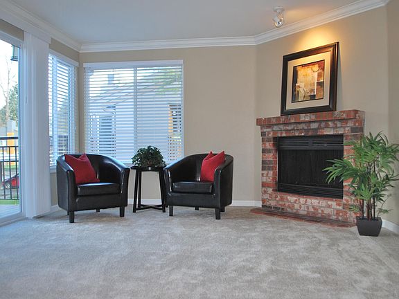 Living room with fireplace and slider to deck.