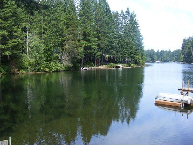 Enjoy fishing & Swimming from your 51' of water front property complete with dock, paddle boat and f