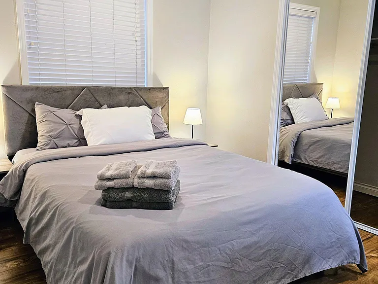Queen bed with fresh bedding