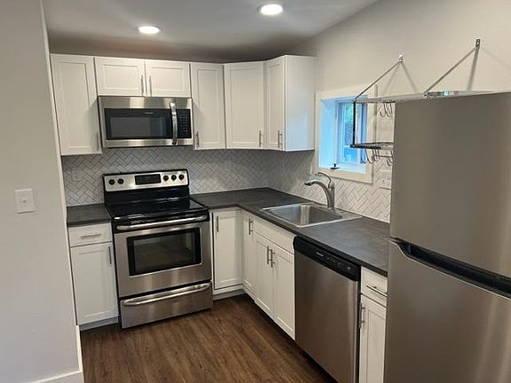 New kitchen with stainless steel appliances