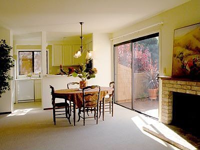 Wood burning fireplace. Sliding doors to deck and large storage room