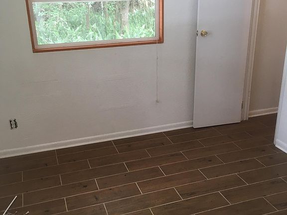 Bedroom with walkin closet on right.