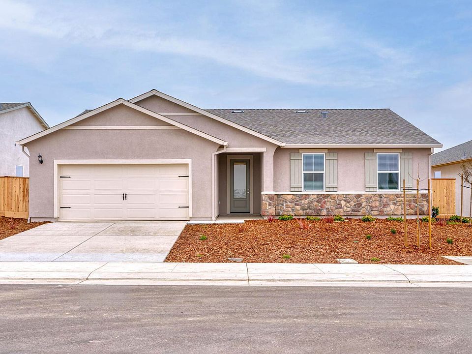 The Colfax is a beautiful single story home with stone and stucco.