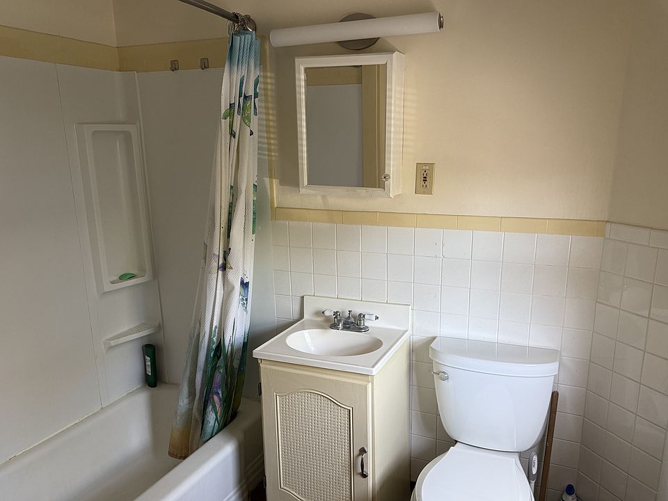 Tiled bathroom with shower surround