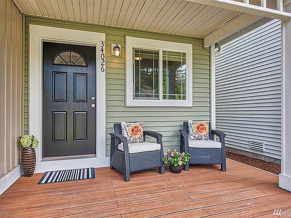Welcoming Covered Front Porch.  The HOA Covers All Exterior Maintenance Of The Home!